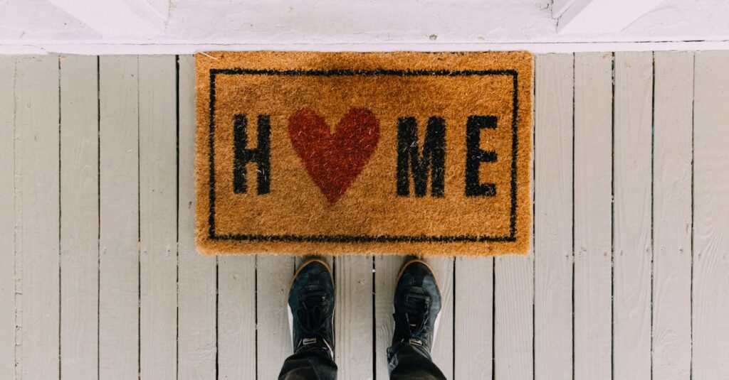 A creative doormat with heart motif symbolizing home at a front porch entrance.
